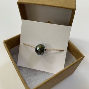 Pandora Essence “Courage” sterling charm in a kraft gift box